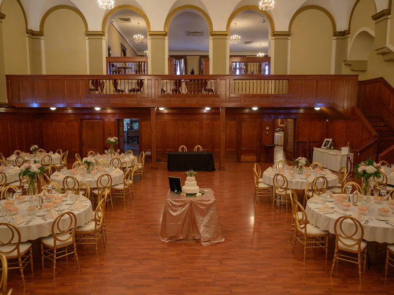 The Corinthian Event Center grand ballroom setup for a wedding reception, ballroom head table view.