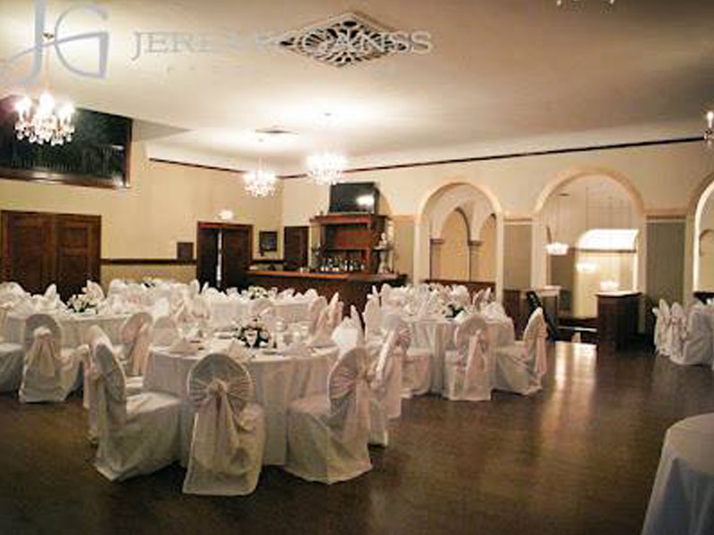 The Corinthian Event Center third floor banquet room setup for a white wedding reception.