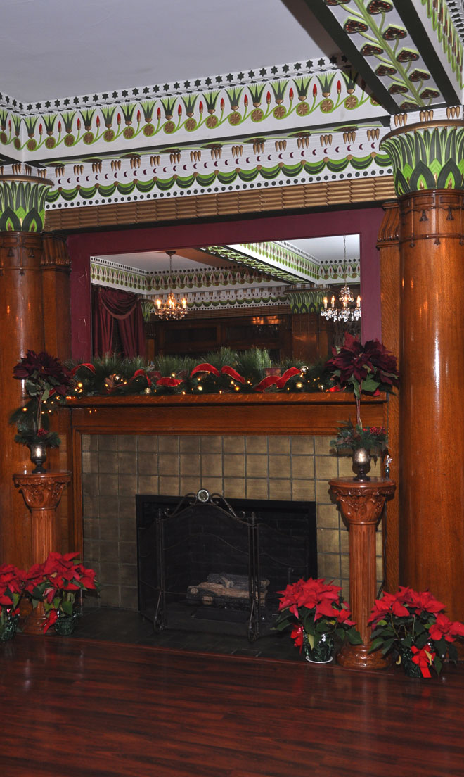Fireplace mantel decorated for Christmass at The Corinthian Event Center.