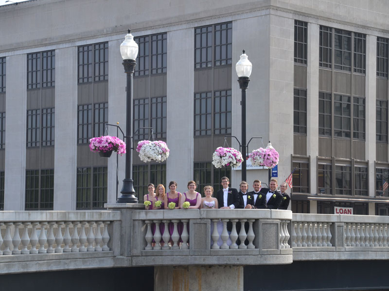 Wedding party on bridge at First Natioal Bank on West State Street near The Corinthian Event Center.