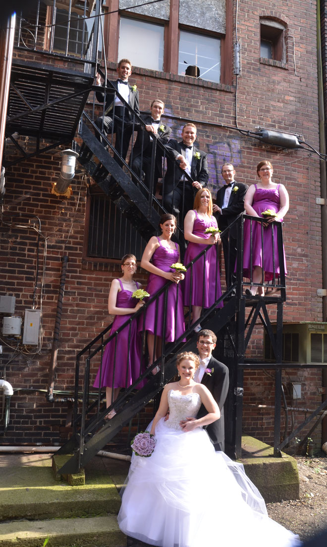 Wedding party on fire escape stairs at The Corinthian Event Center.
