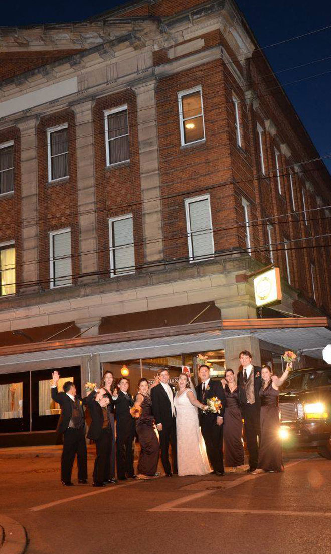 Wedding party on street at night with limosine at The Corinthian Event Center.
