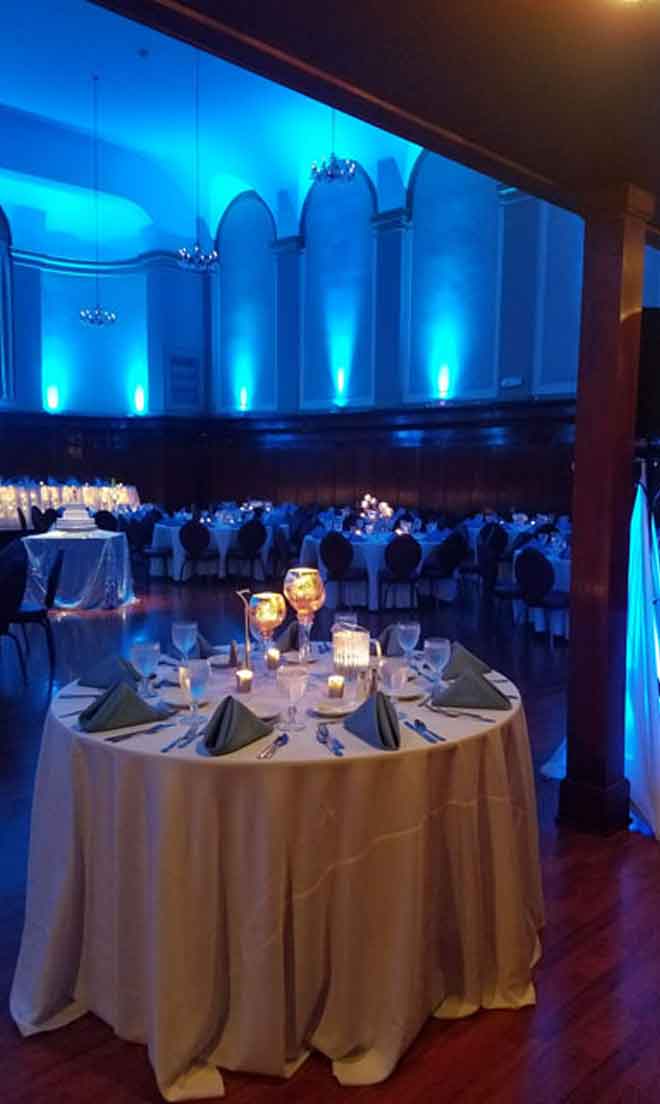 Grand Ballroom setup in silver theme with candle decor centerpieces at The Corinthian Event Center.