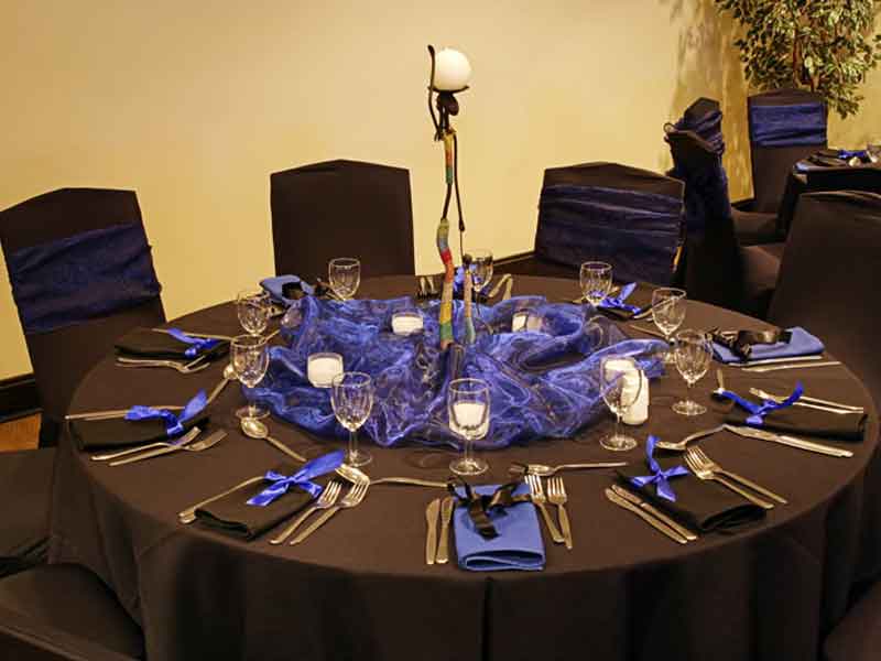 Rehersal reception setup in black and blue theme at The Corinthian Event Center.