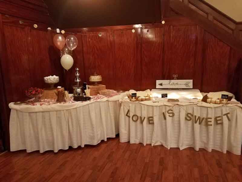 Sweets table setup at The Corinthian Event Center.