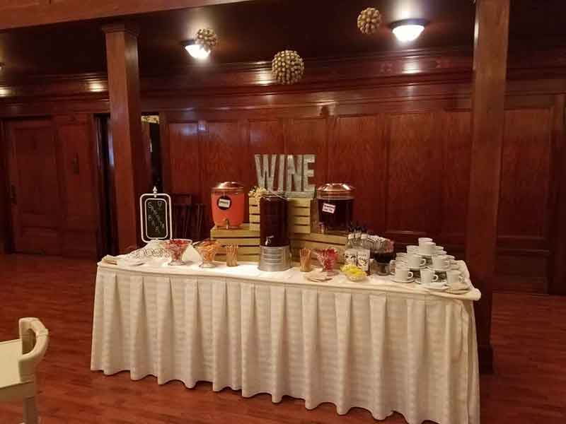 Wine table setup at The Corinthian Event Center.