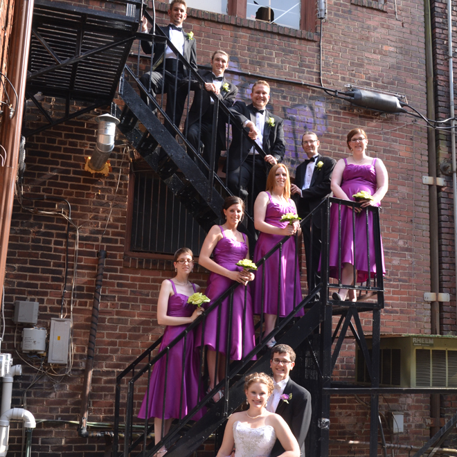 Bridal party on back stairs of The Corinthinan Events Center.