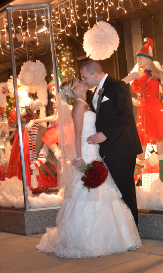 Bride and groom embrace outside The Corinthian Event Center.